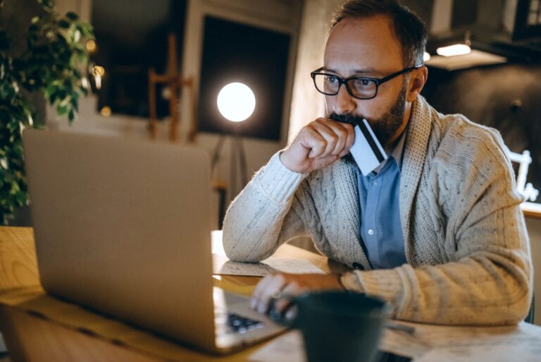 Man Reviewing Credit Card Decline